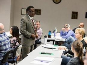 LTSS professor talking to students in a classroom.